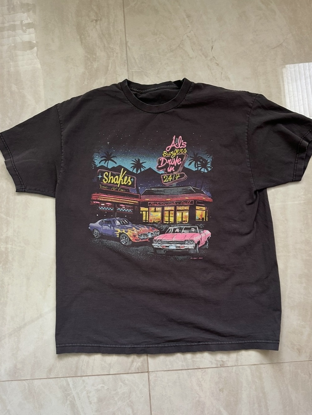 Brandy Melville Vintage-Style Black Graphic Tee with Retro Drive-In Print